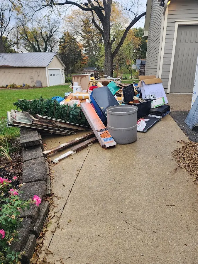 Dumpster being loaded with debris for Demolition Dumpster Rental in Cudahy